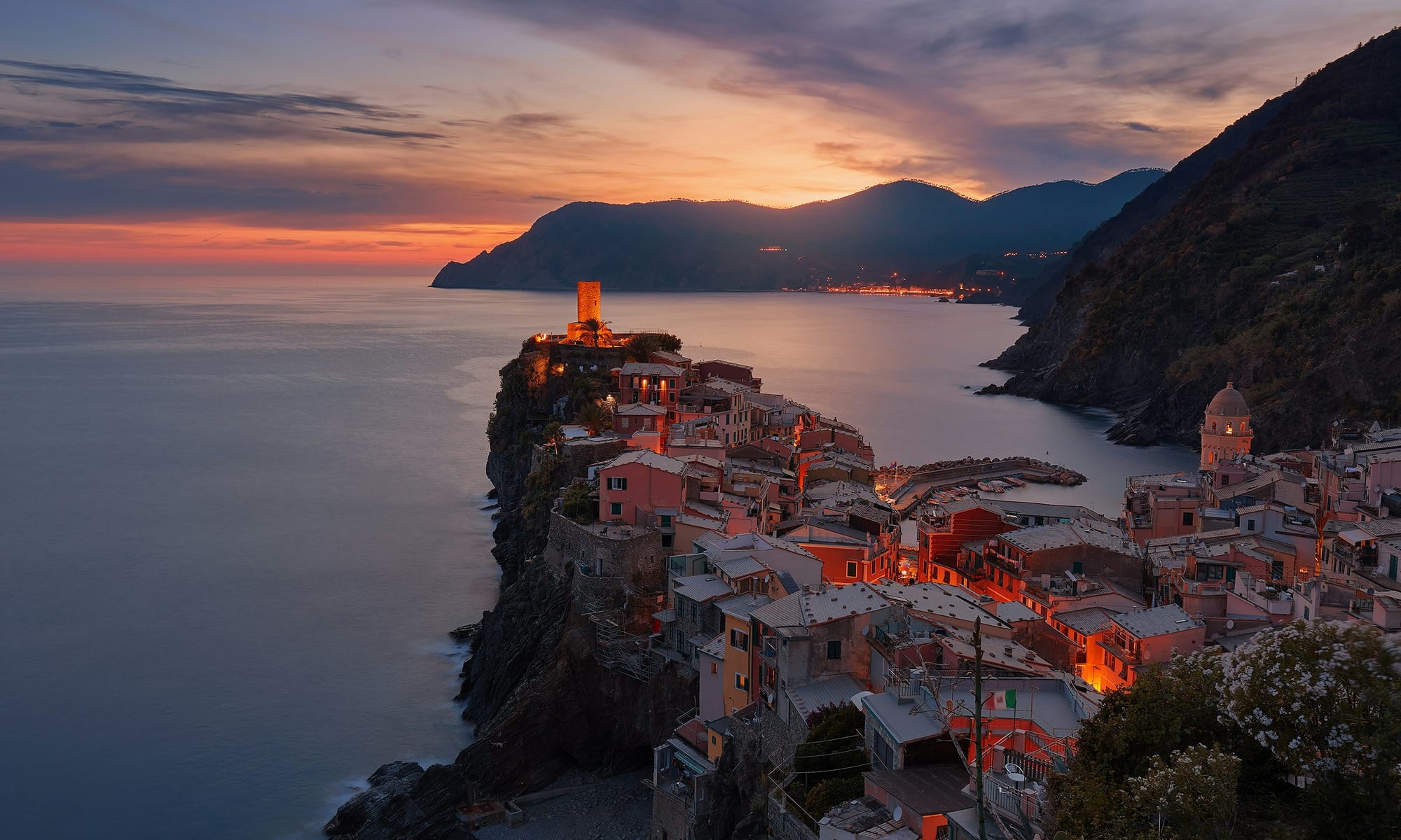 Aerial view of Positano at sunset — a cliffside Amalfi Coast village in warm golden light